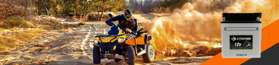A person riding an ATV on dirt, Flooded Lead Acid Battery hero