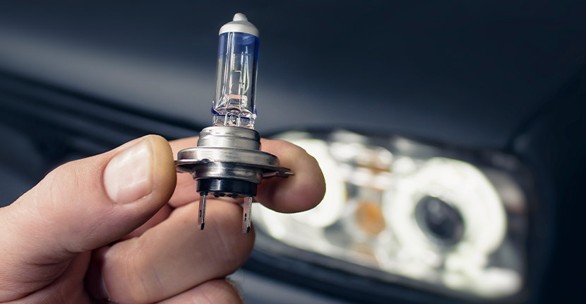 Holding a replacement car headlight
